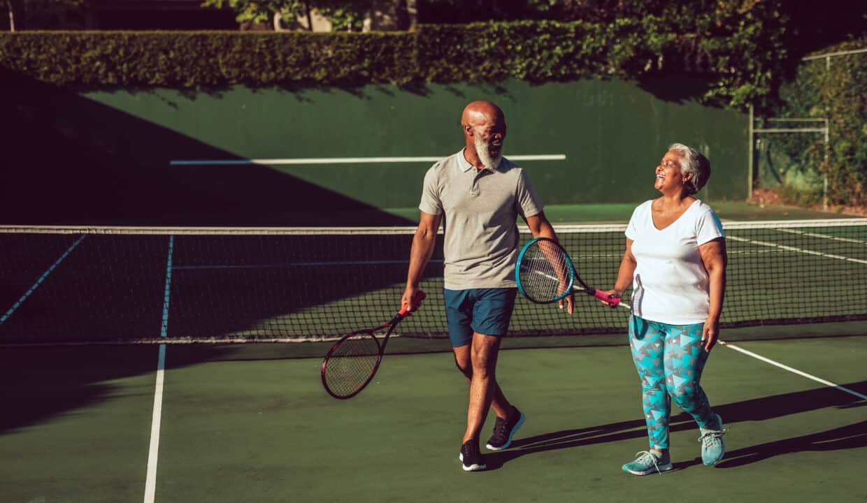 Portrait,Of,Smiling,Senior,African,American,Couple,With,Tennis,Rackets