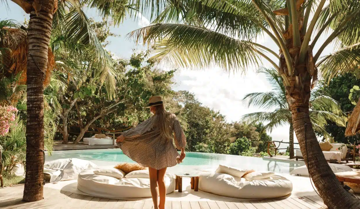 Happy,Woman,Enjoying,Warm,Sunny,Day,Near,Infinity,Pool,With